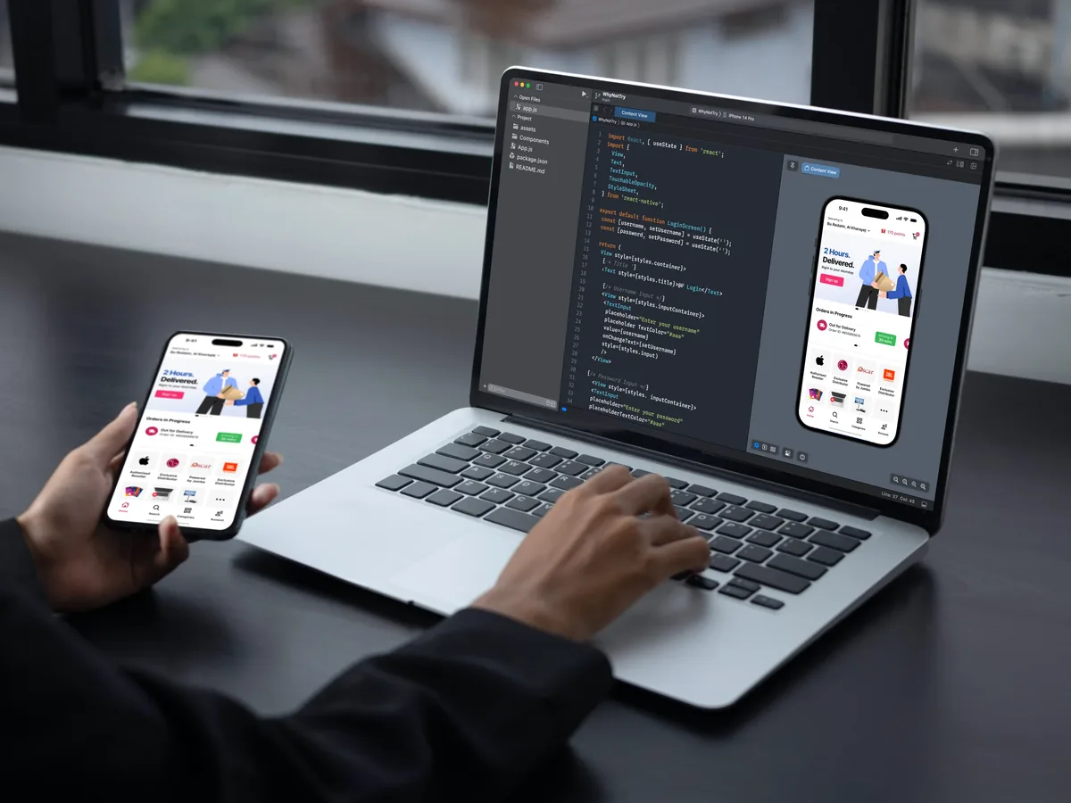 Person testing a shopping app on a phone beside a laptop showing the same app and its code