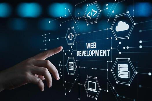 Hand reaching toward a glowing web development diagram of code, cloud, database and device icons